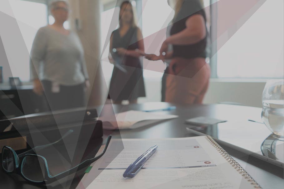 Photo of people discussing in an office