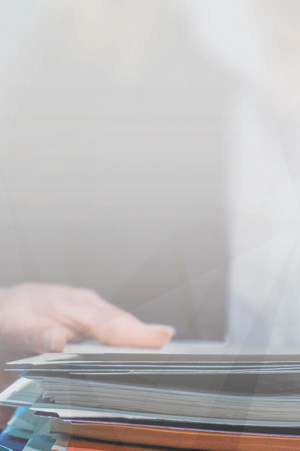 Image of a hand and files