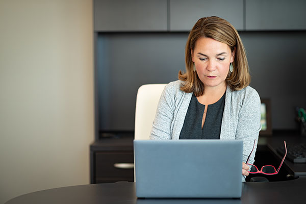 Commissioner working on a laptop