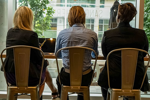 OIC employees sitting at a table